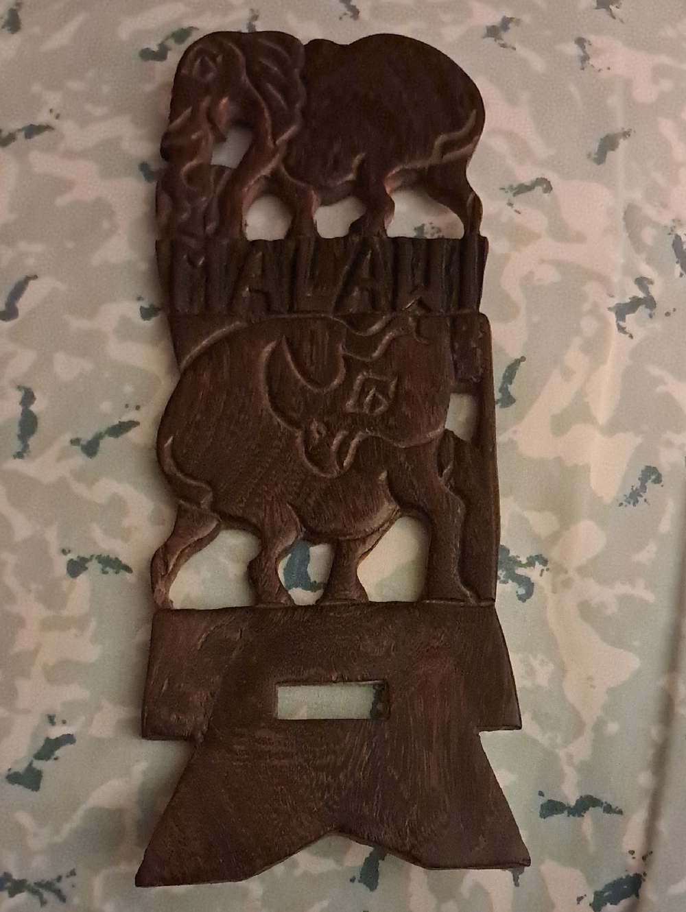 Carved wood with rhino and elephant and malawi